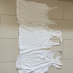 3 Lululemon white tank tops